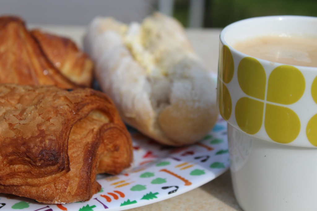 Image of a French breakfast with a coffee cup to the side.

This image is copyrighted.